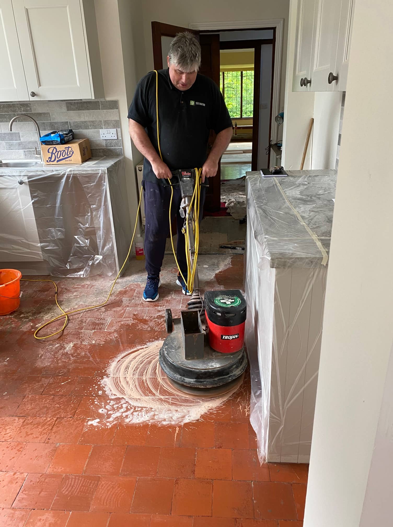 Old Victorian Period Red 6 inch floor tiles during cleaning in Windermere