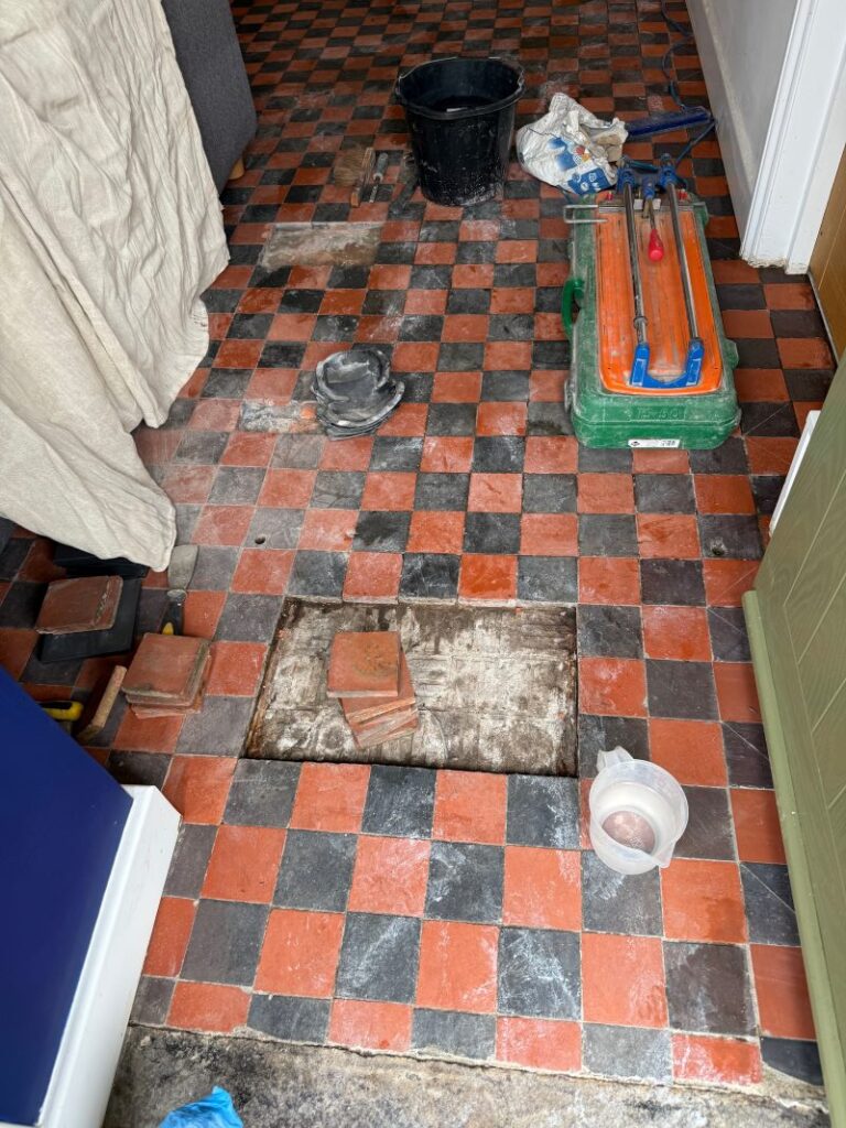 Red and Black Dorchester Pattern Quarry Tiled Floor During Repair in Kendal