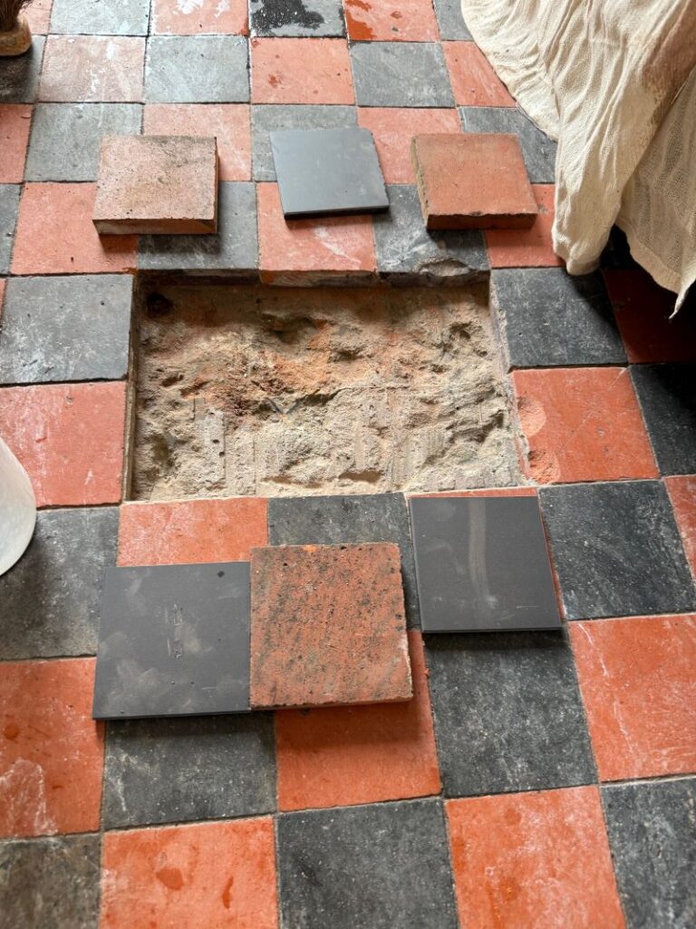 Red and Black Dorchester Pattern Quarry Tiled Floor During Repair in Kendal